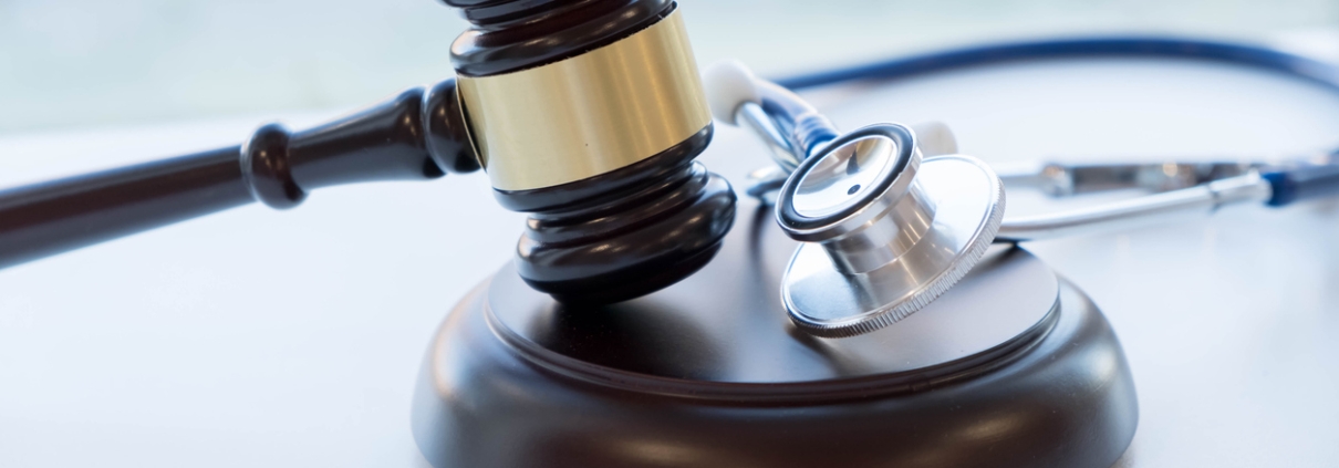 Gavel and stethoscope. medical jurisprudence. legal definition of medical malpractice. attorney. common errors doctors, nurses and hospitals make.