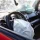 A deployed air bag and broken windshiled