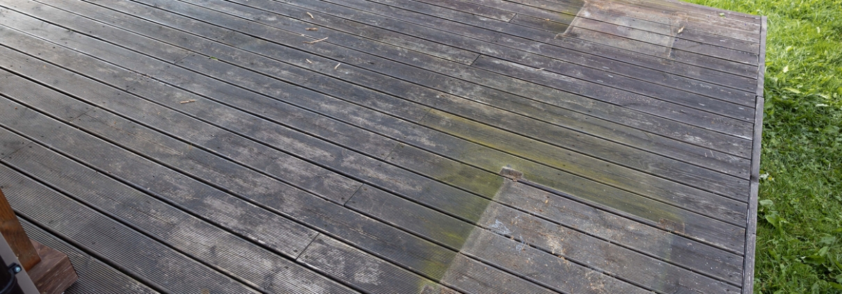 Weathered wooden deck, terrace with algae and moss, spring cleaning in garden and yard
