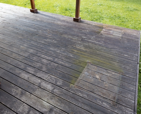 Weathered wooden deck, terrace with algae and moss, spring cleaning in garden and yard