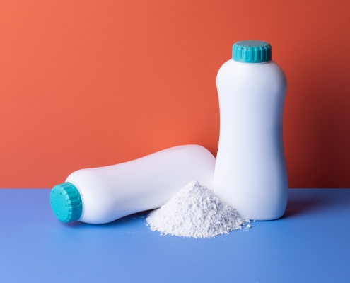 Skin care with talcum powder in container