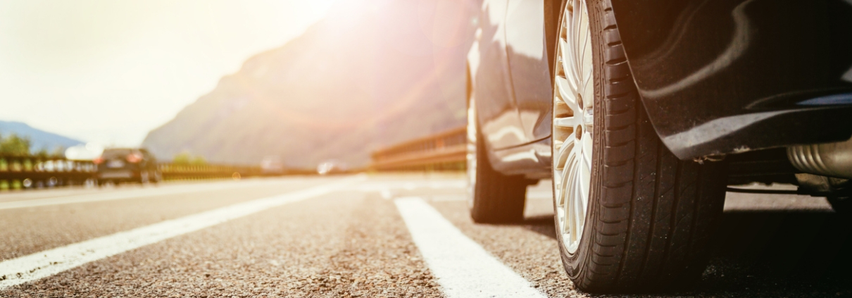 Close up of a car standing on a breakdown lane, summer vacation