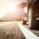 Close up of a car standing on a breakdown lane, summer vacation