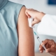 Hands, medical and doctor with patient for vaccine in a clinic for healthcare treatment for prevention. Closeup of a nurse doing a vaccination injection with a needle syringe in a medicare hospital.