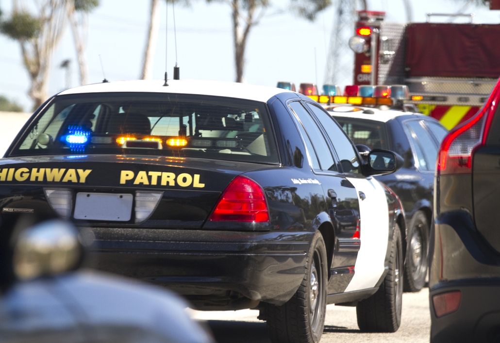 Highway Patrol cars at the scene of a car accident.