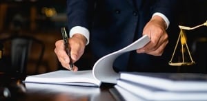 lawyer signing documents