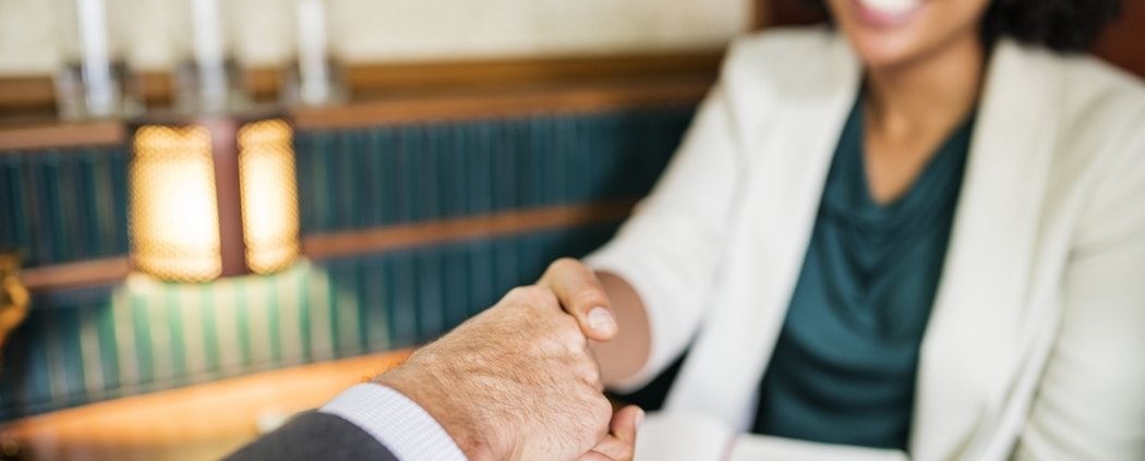 lawyer shaking hands with a client