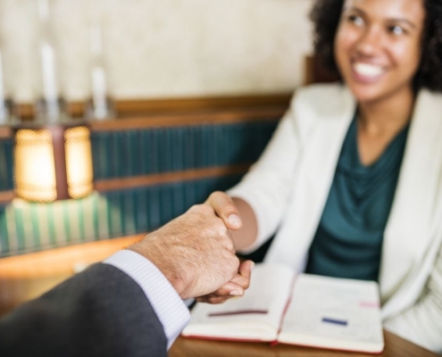 lawyer shaking hands with a client