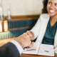 lawyer shaking hands with a client