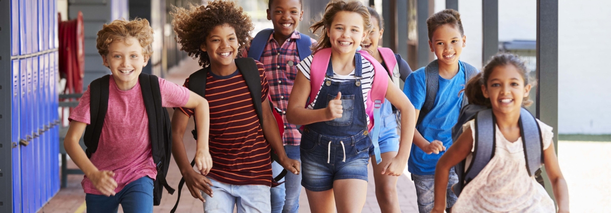 group of school kids running