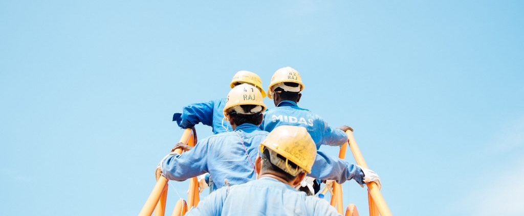 workers climbing a ladder