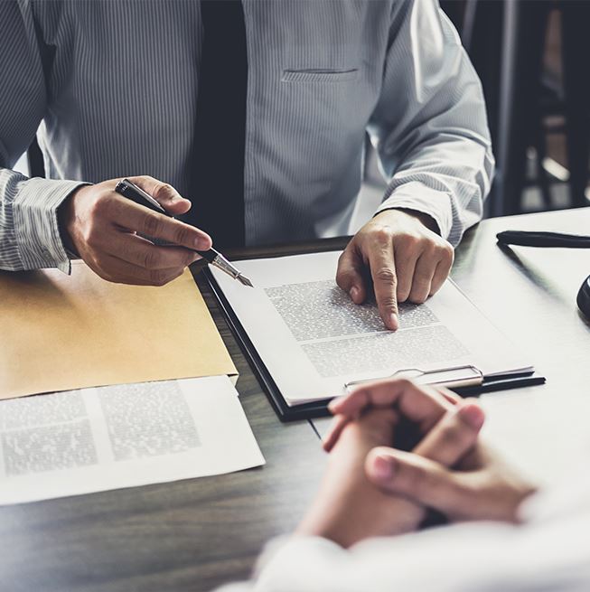 lawyer explaining documents to his client