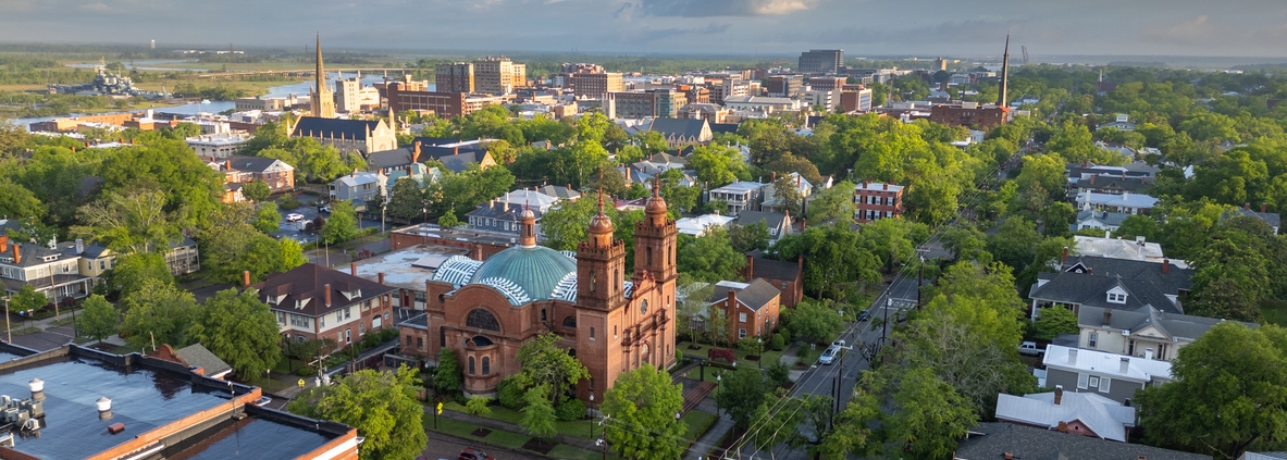 Wilmington, North Carolina, USA historic churches and downtown viewed from above.
