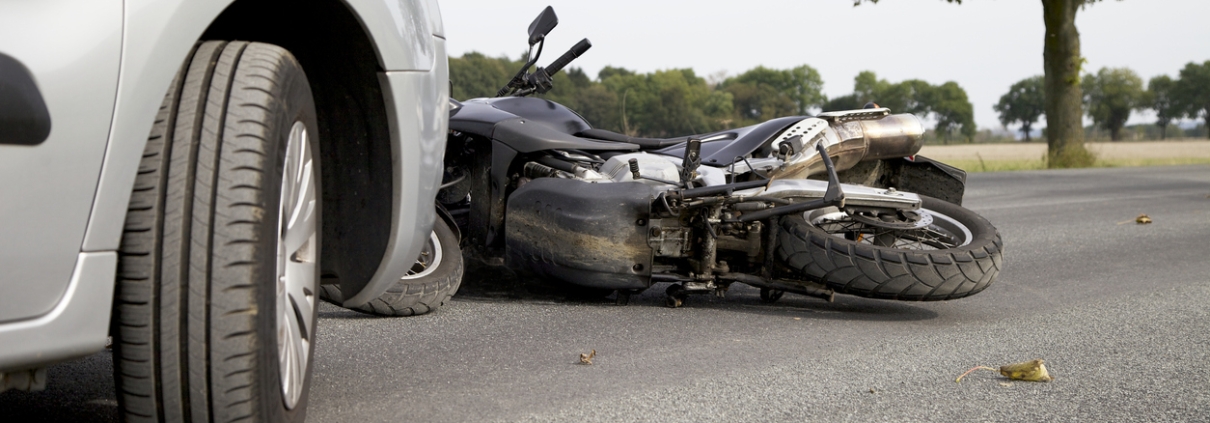 Motorbike Accident on the road with a car