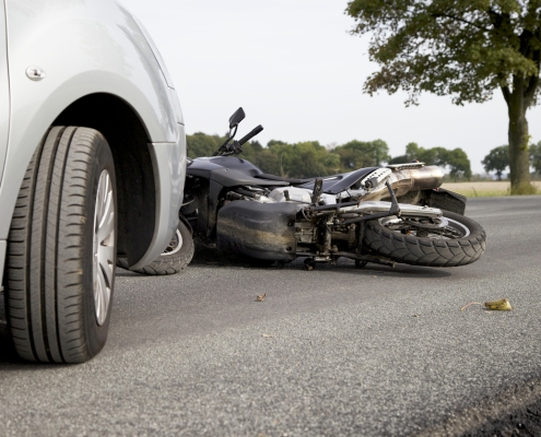 Motorbike Accident on the road with a car