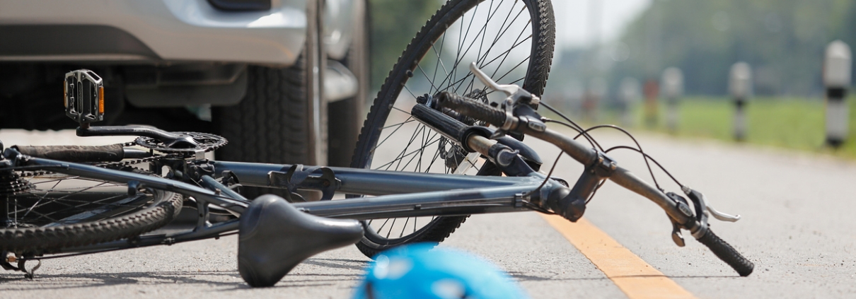 Accident car crash with bicycle on road