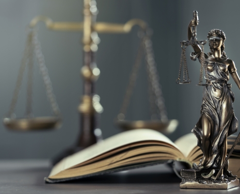 Legal and law concept statue of Lady Justice on the table with book and scale