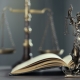 Legal and law concept statue of Lady Justice on the table with book and scale