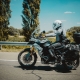 A racer in sportswear on a motorbike on a highway