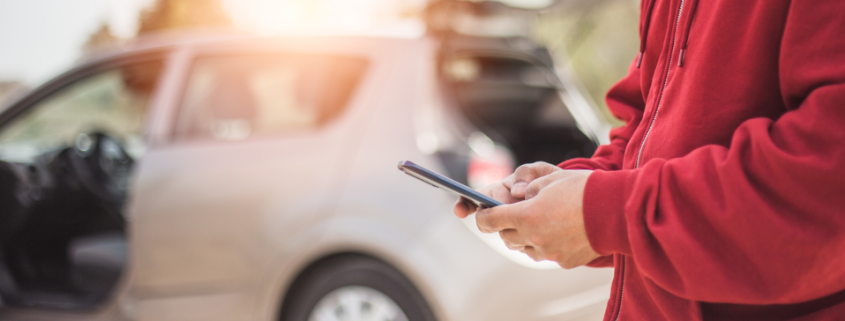 Man texting after a car accident