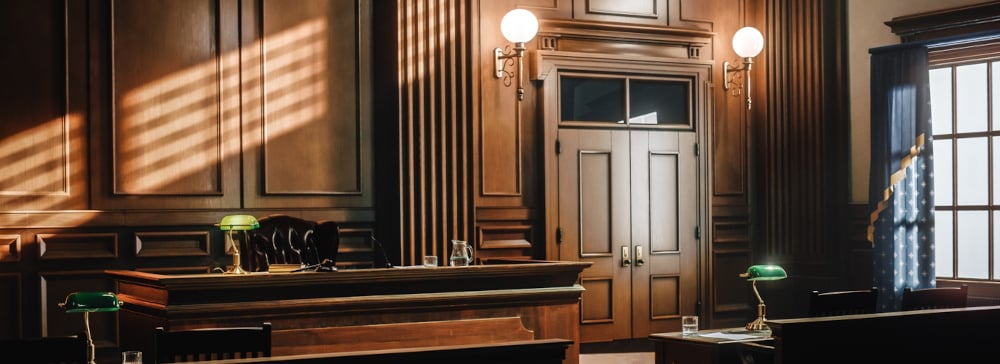 Empty American Style Courtroom. Supreme Court of Law and Justice Trial Stand. Courthouse Before Civil Case Hearing Starts. Grand Wooden Interior with Judge's Bench, Defendant's and Plaintiff's Tables.