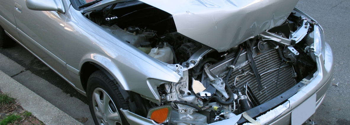Photo of car with a lot of damage-probably at least $6000.