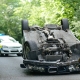 Car accident crash flipped upside down, road closed by police