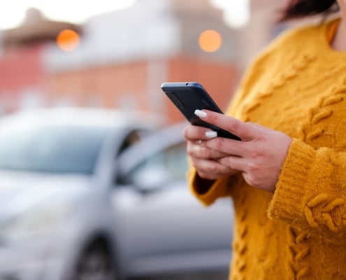 young woman Hispanic crashed with his car using his cell phone. road safety concept
